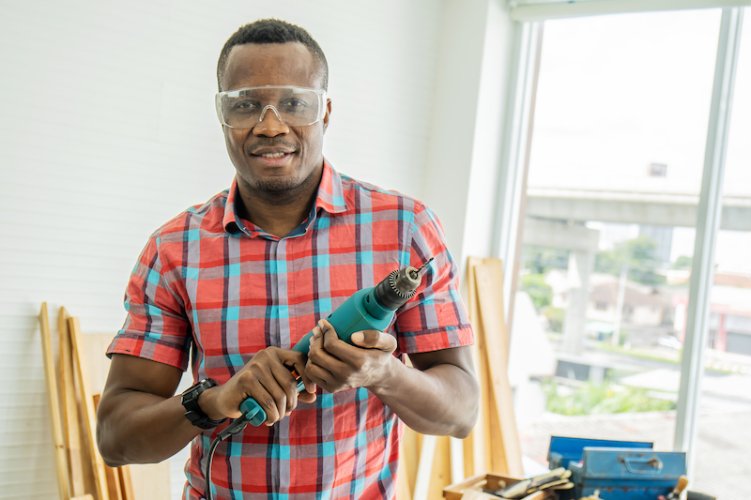 vecteezy_work-in-the-carpentry-workshop-african-american-happy-male_7424147_29.jpg